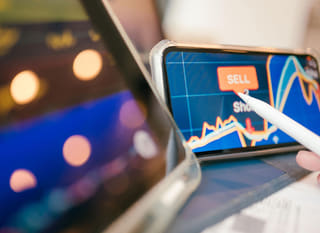 Trader reviewing Bitcoin, Ethereum, and forex options across multiple markets