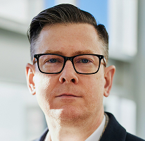 Alexander Hughes, CEO at a crypto trading company, portrait